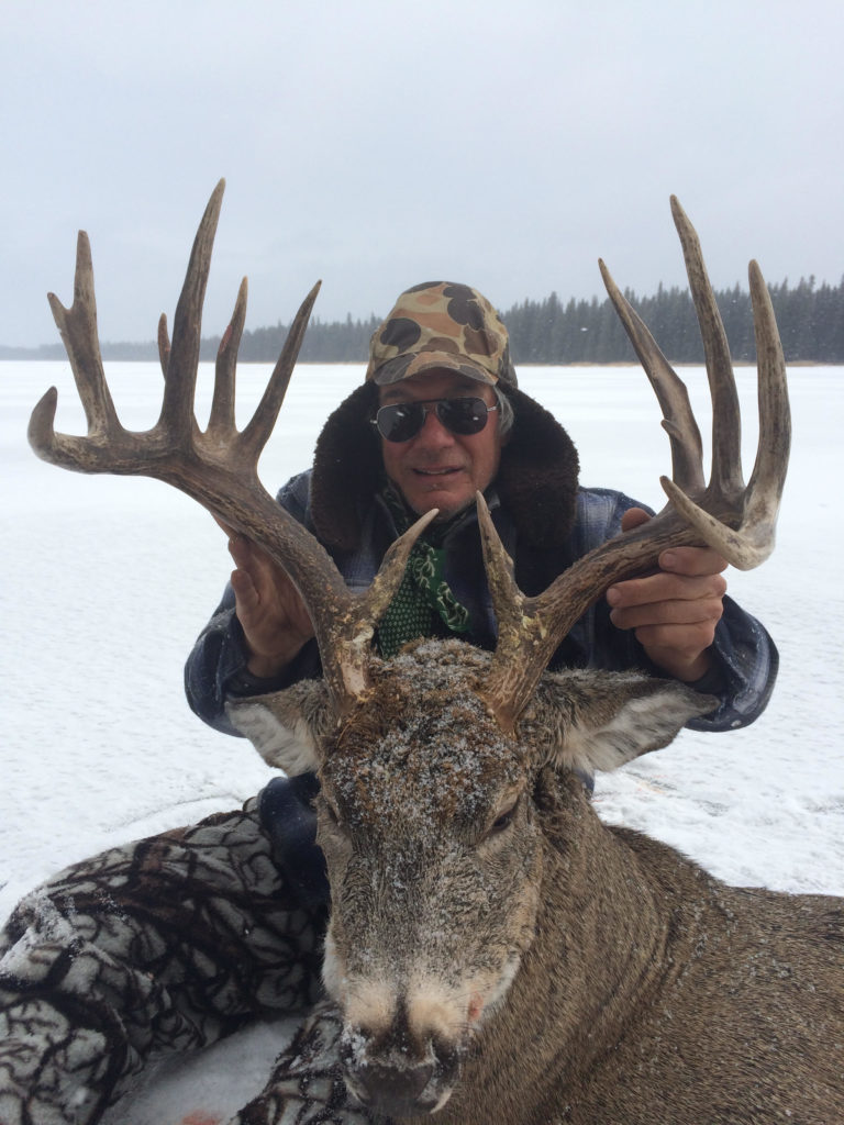 hunter with shot deer