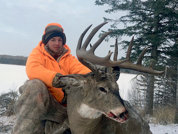 hunter with whitetail deer